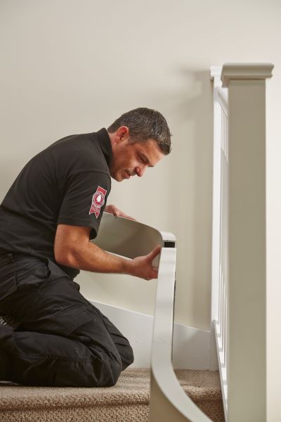 Acorn Installer installing a stairlift into a household
